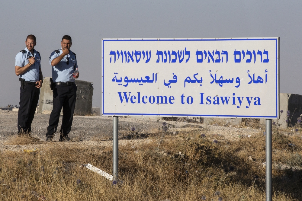 Israeli police take security measures around as a group of people gather to protest against Israeli violations towards Palestinians in Al-Isaviyya town of East Jerusalem on June 27, 2019. (Faiz Abu Rmeleh/Anadolu Agency)