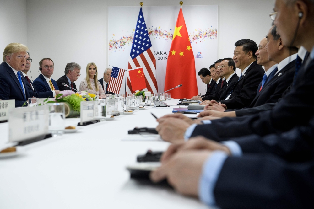 US President Donald Trump and China's President Xi Jinping attend a bilateral meeting on the sidelines of the G20 Summit in Osaka on June 29, 2019. / AFP / Brendan Smialowski