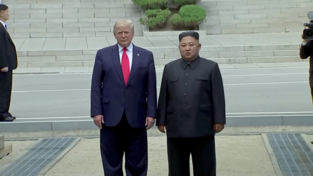 U.S. President Donald Trump meets with North Korean leader Kim Jong Un at the demilitarised zone (DMZ) separating the two Koreas, in Panmunjom, South Korea, in this still image from video taken June 30, 2019. U.S. Network Pool/via REUTERS TV UNITED STATES