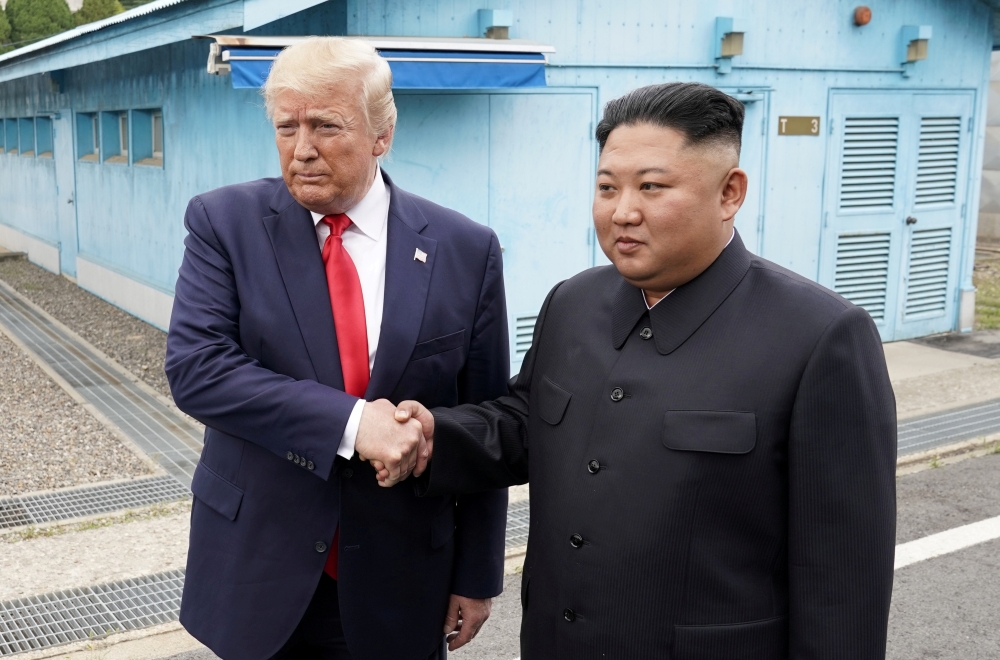 US President Donald Trump meets with North Korean leader Kim Jong Un at the demilitarized zone separating the two Koreas, in Panmunjom, South Korea, June 30, 2019. REUTERS/Kevin Lamarque