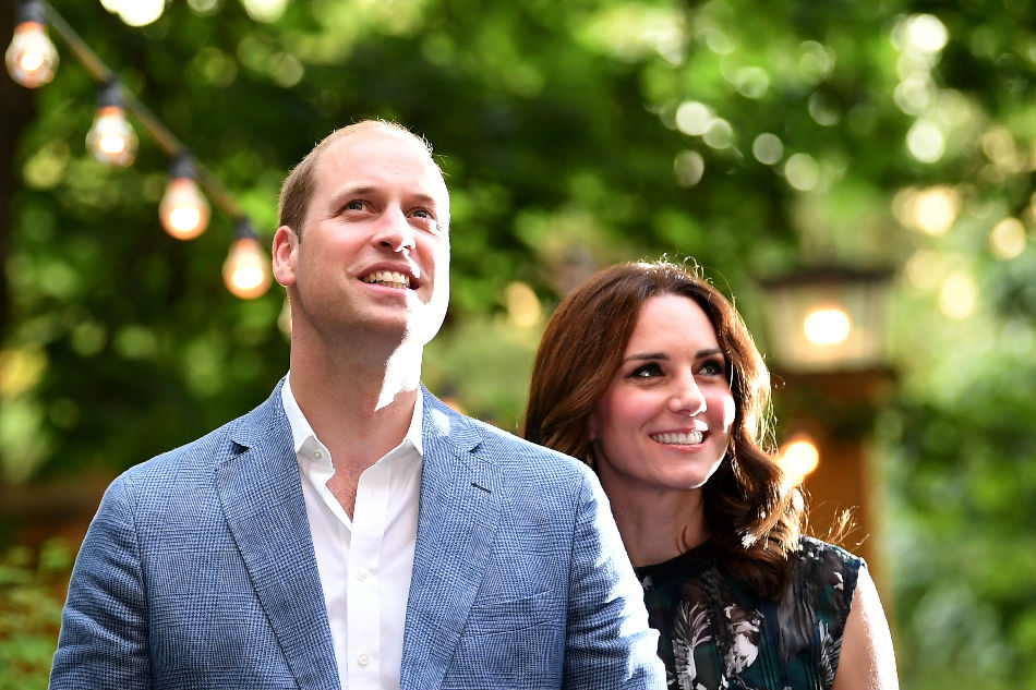 Britain's Prince William, the Duke of Cambridge and his wife Princess Kate, the Duchess of Cambridge, attend a reception at Claerchens Ballhaus, in Berlin Germany, July 20, 2017. Britta Pedersen, Reuters/File Photo