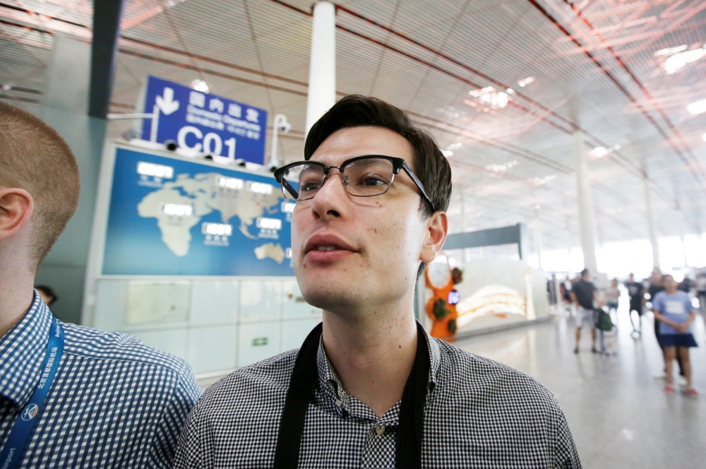 An Australian student Alek Sigley, 29, who was detained in North Korea, departs from Beijing to Japan, at the Beijing international airport, China, July 4, 2019. REUTERS/Jason Lee
