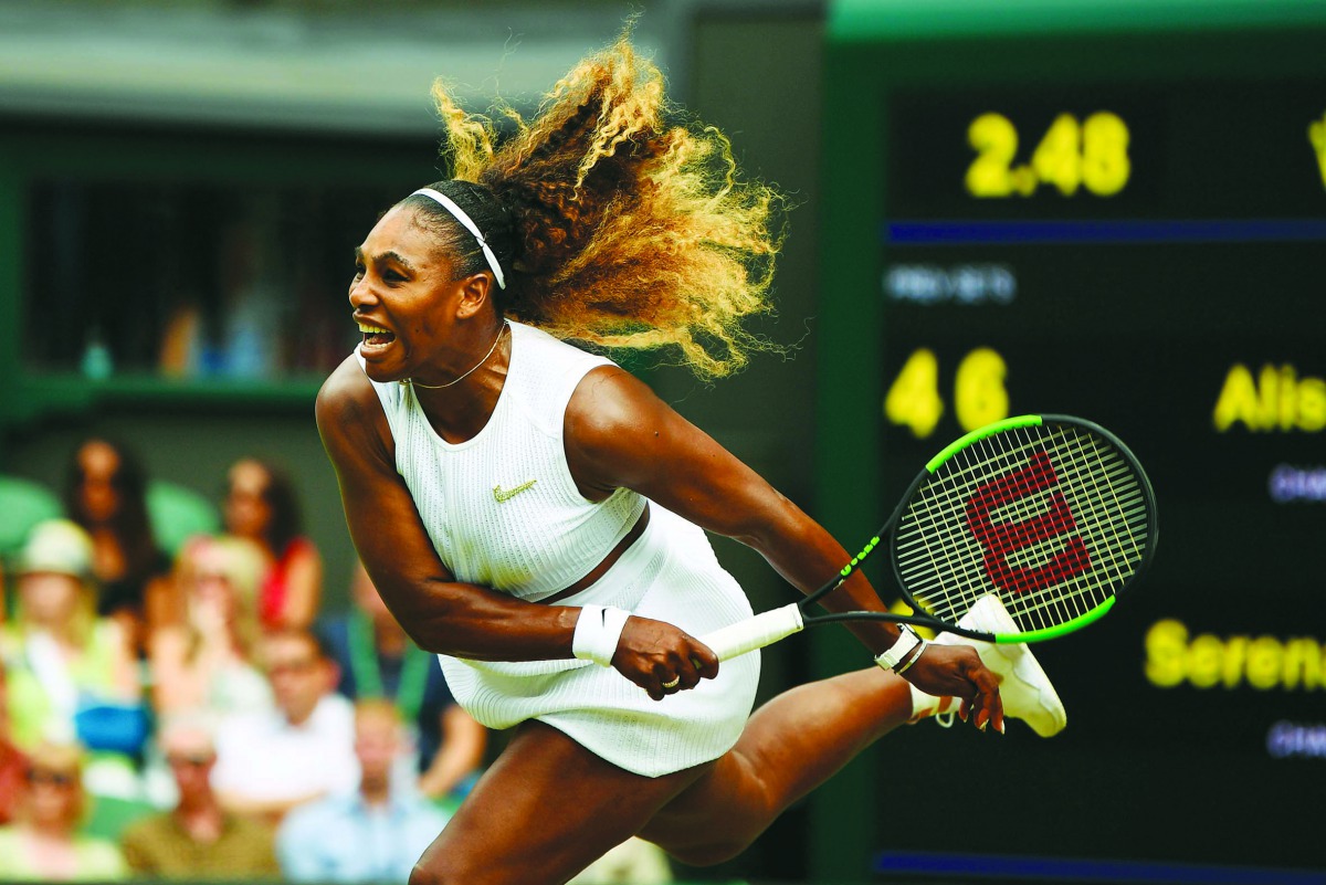 US player Serena Williams serves against US player Alison Riske during their women's singles quarter-final match on day eight of the 2019 Wimbledon Championships at The All England Lawn Tennis Club in Wimbledon, southwest London, on July 9, 2019.  AFP / D