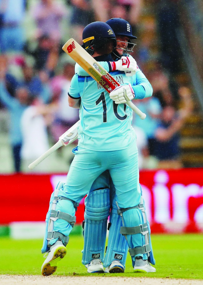  England's Eoin Morgan and Joe Root celebrate after the match. (Action Images via Reuters/Andrew Boyers) 
