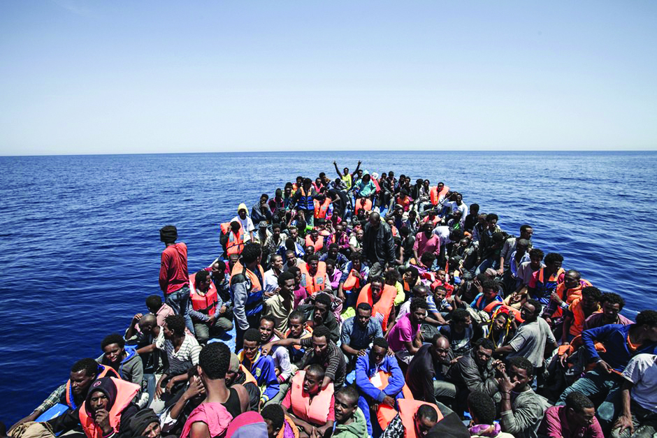 A file photo showing an overcrowded boat with migrants from different African countries is pictured off the Libyan coast in the Mediterranean Sea.