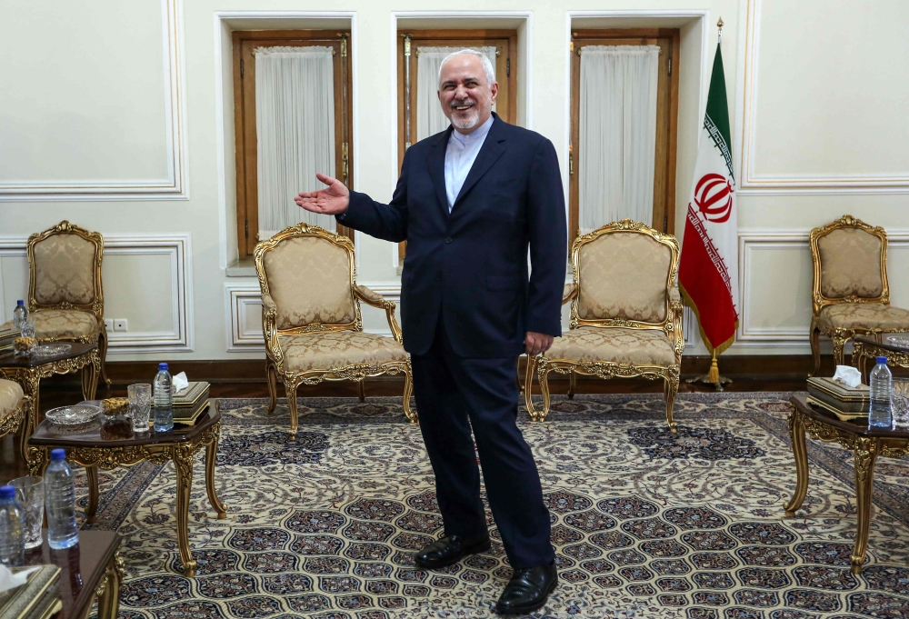 Iranian Foreign Minister Mohammad Javad Zarif gestures as he stands in an office as he meets with the diplomatic advisor to the French president in the capital Tehran on July 10, 2019. (AFP / ATTA KENARE)