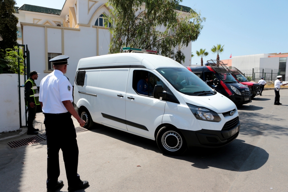 Men, accused in the killing of a Danish and Norwegian hikers in the Atlas mountains near Marrakech last December, are seen inside a car after leaving the courtroom in Sale, near Rabat, Morocco, July 18, 2019. Reuters/Youssef Boudlal