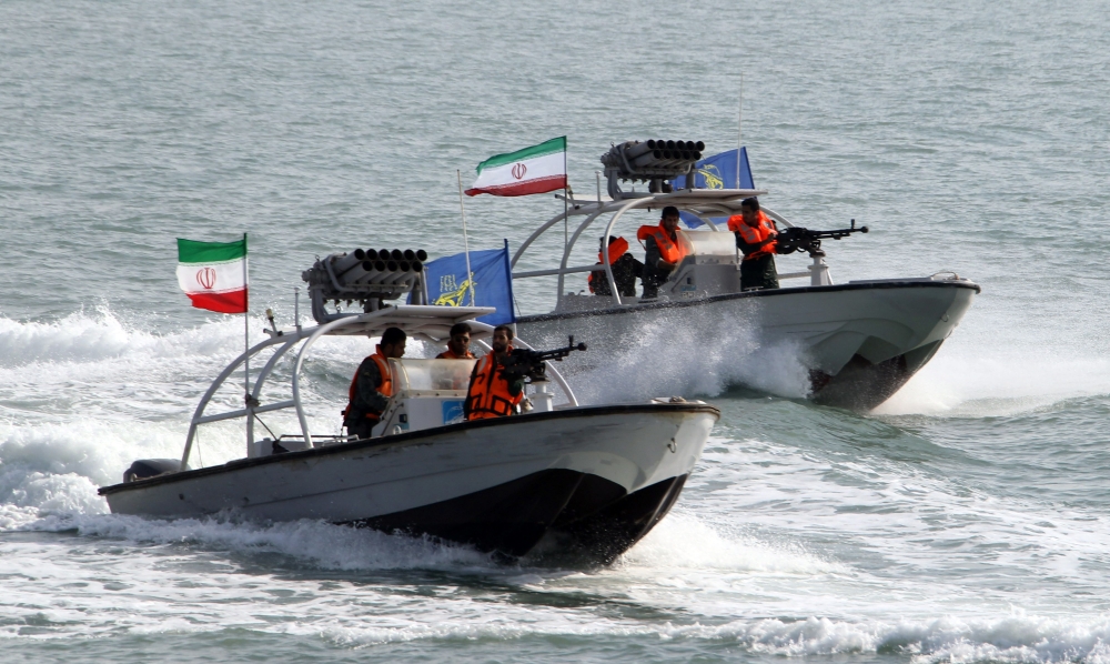 In this file photo taken on July 02, 2012 Iranian Revolutionary Guards drive speedboats during a ceremony to commemorate the 24th anniversary of the downing of Iran Air flight 655 by the US navy, at the port of Bandar Abbas. (AFP / Atta KENARE)