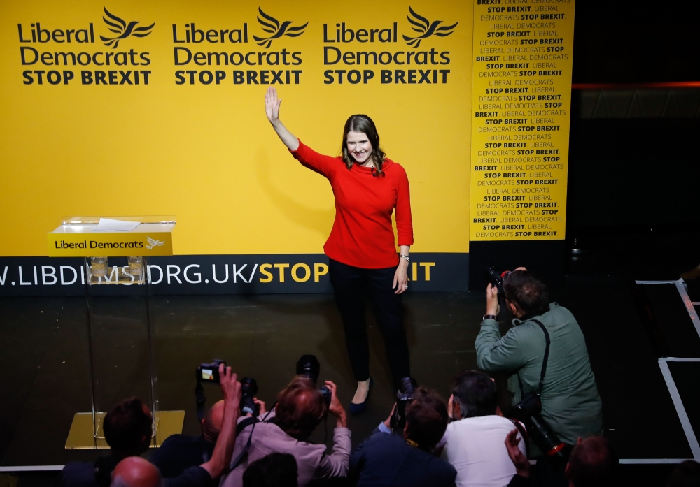 New Liberal Democrat leader Jo Swinson waves on stage at an event annoucing the result of the leadership contest in central London on July 22, 2019. Jo Swinson, Vince Cable's deputy for two years, was unveiled as the new leader of the Liberal Democrats. (