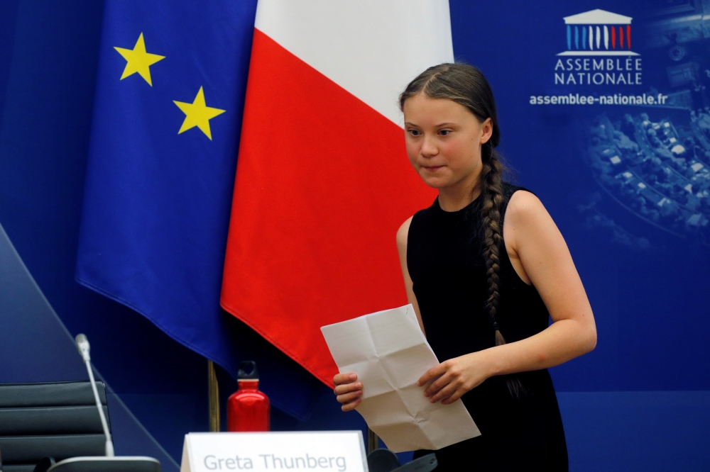 Swedish environmental activist Greta Thunberg attends a debate with French parliament members at the National Assembly in Paris, France, July 23, 2019. (REUTERS/Philippe Wojazer)