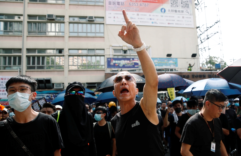 People demonstrate outside the police station during a protest against the Yuen Long attacks in Yuen Long, New Territories, Hong Kong, China July 27, 2019. REUTERS/Edgar Su