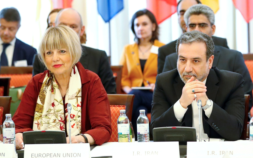 Iran's top nuclear negotiator Abbas Araqchi and Secretary General of the European External Action Service (EEAS) Helga Schmid attend a meeting of the JCPOA Joint Commission in Vienna, Austria, June 28, 2019. (REUTERS/Leonhard Foeger)