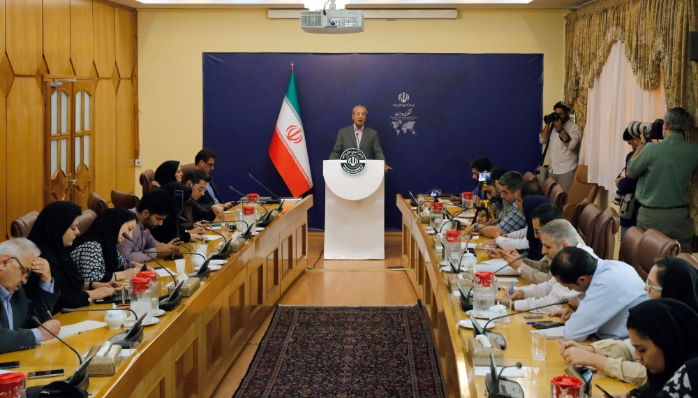 Iranian government spokesman Ali Rabiei (C) speaks during a news conference in the capital Tehran on July 22, 2019. (AFP)