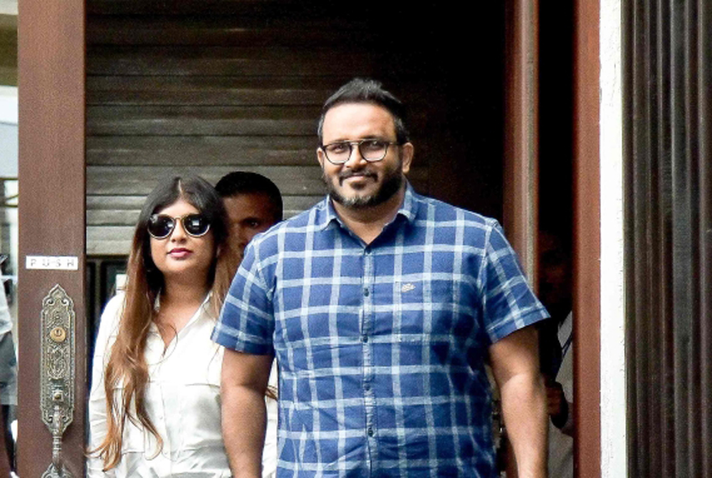 FILE PHOTO: Jailed former vice-president Ahmed Adeeb (R) walks along with his wife Mariyam Nashwa (L) as he returns to Maldives after receiving medical treatment from abroad at Velana International Airport in Male. AFP / Ahmed SHURAU
