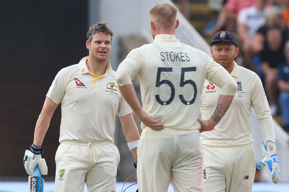 Australia's Steve Smith (L) reacts after being struck by the ball from England's Ben Stokes during play on the third day of the first Ashes cricket test match between England and Australia at Edgbaston in Birmingham, central England on August 3, 2019. (AF