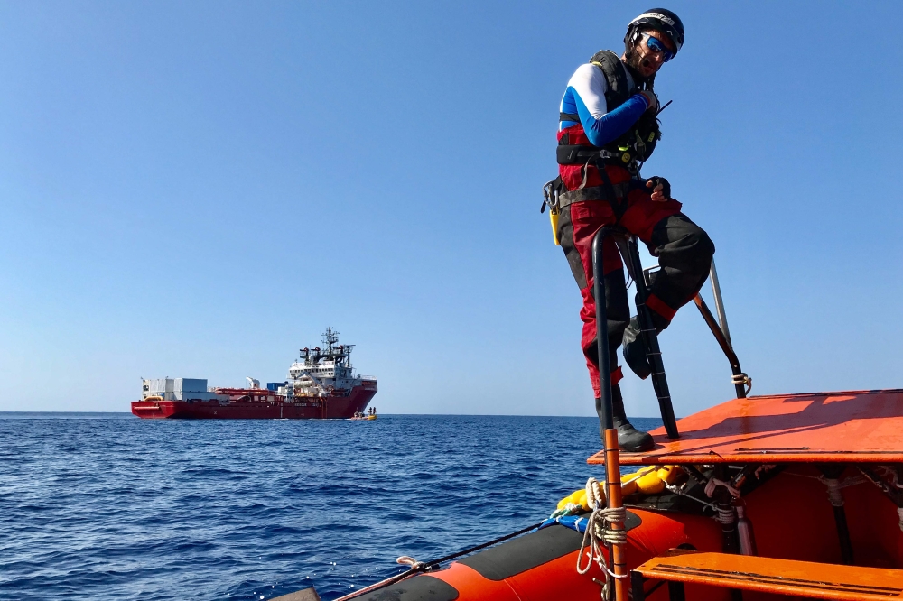 A member of the French NGOs SOS Mediterranee and Medecins sans Frontieres (MSF) new boat Ocean Viking takes part in a team exercise to get ready for a rescue situation at sea with a 