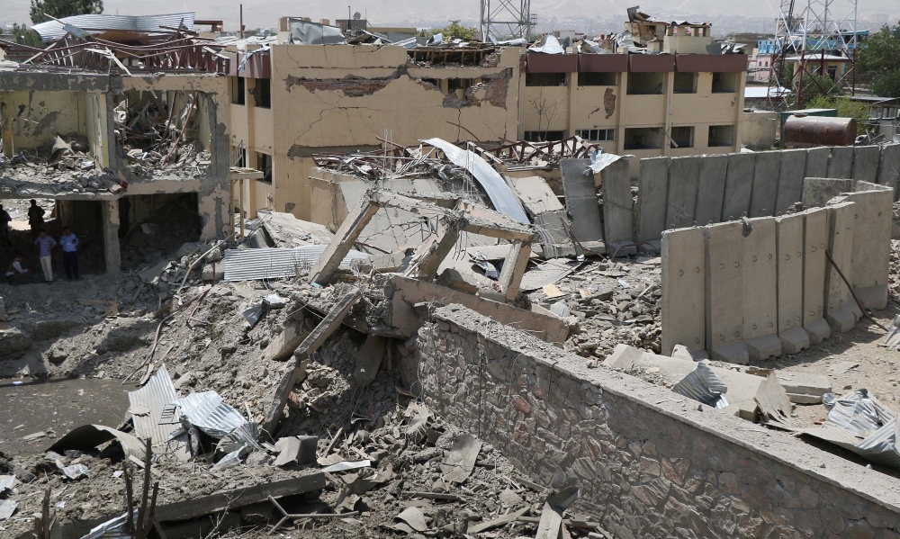 A collapsed building is seen after a suicide car targeted police in the crowded Mirwais Maidan neighborhood during rush hours in Kabul, Afghanistan on 07 August 2019. Haroon Sabawoon - Anadolu 