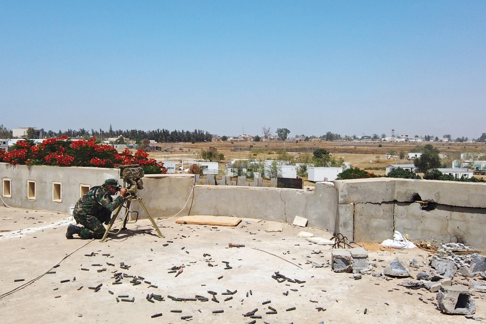 FILE PHOTO A member of the Libyan internationally recognised government forces is seen during a fight with Eastern forces, in southern Tripoli, Libya June 22, 2019. REUTERS/Yosri al-Jamal