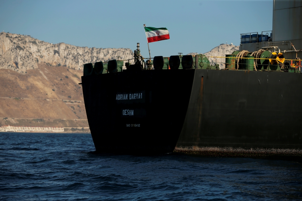 The Iranian flag flies on board the Iranian oil tanker Adrian Darya 1, formerly named Grace 1, as it sits anchored after the Supreme Court of the British territory lifted its detention order, in the Strait of Gibraltar, Spain, August 18, 2019. REUTERS/Jon
