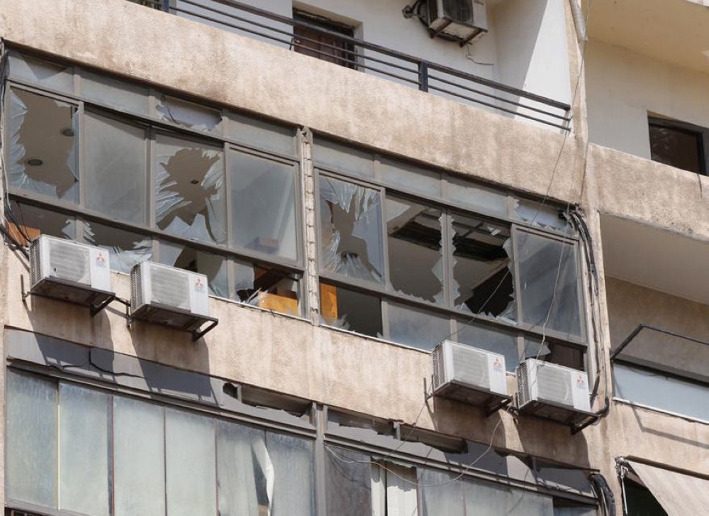 Broken windows are pictured after an Israeli drone fell in the Hezbollah-dominated southern suburbs and a second one exploded near the ground in Dahiyeh suburbs of Beirut, Lebanon August 25, 2019. REUTERS/Mohamed Azakir