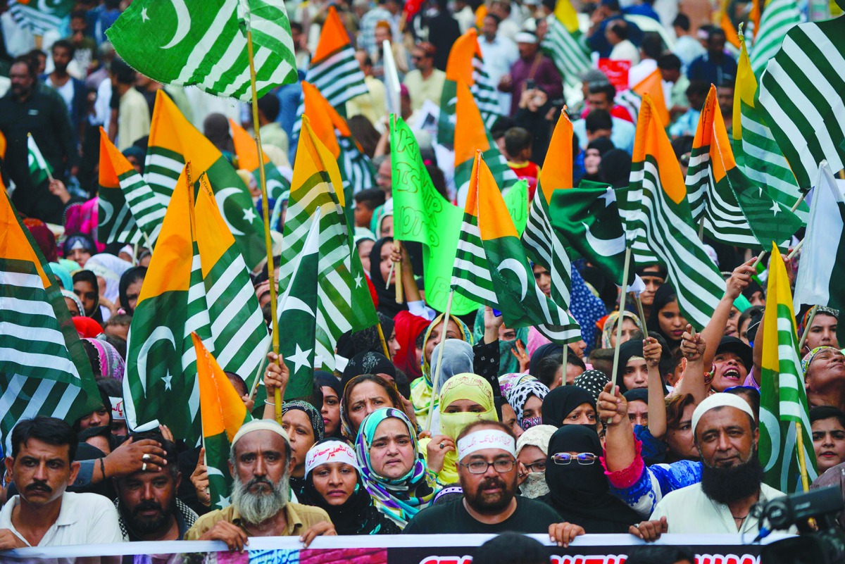 Demonstrators hold flags of Pakistan administered Kashmir during an anti-India protest rally in Karachi on August 25, 2019, in solidarity with India-administered Kashmiri. AFP / Rizwan Tabassum