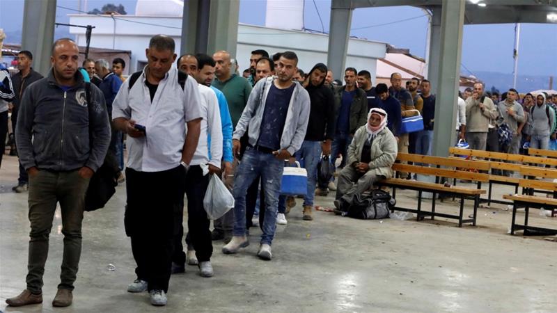 Palestinian workers wait to cross the Israeli-controlled Al-Jalama checkpoint as they head to work in Israel, near Jenin in the Israeli-occupied West Bank.