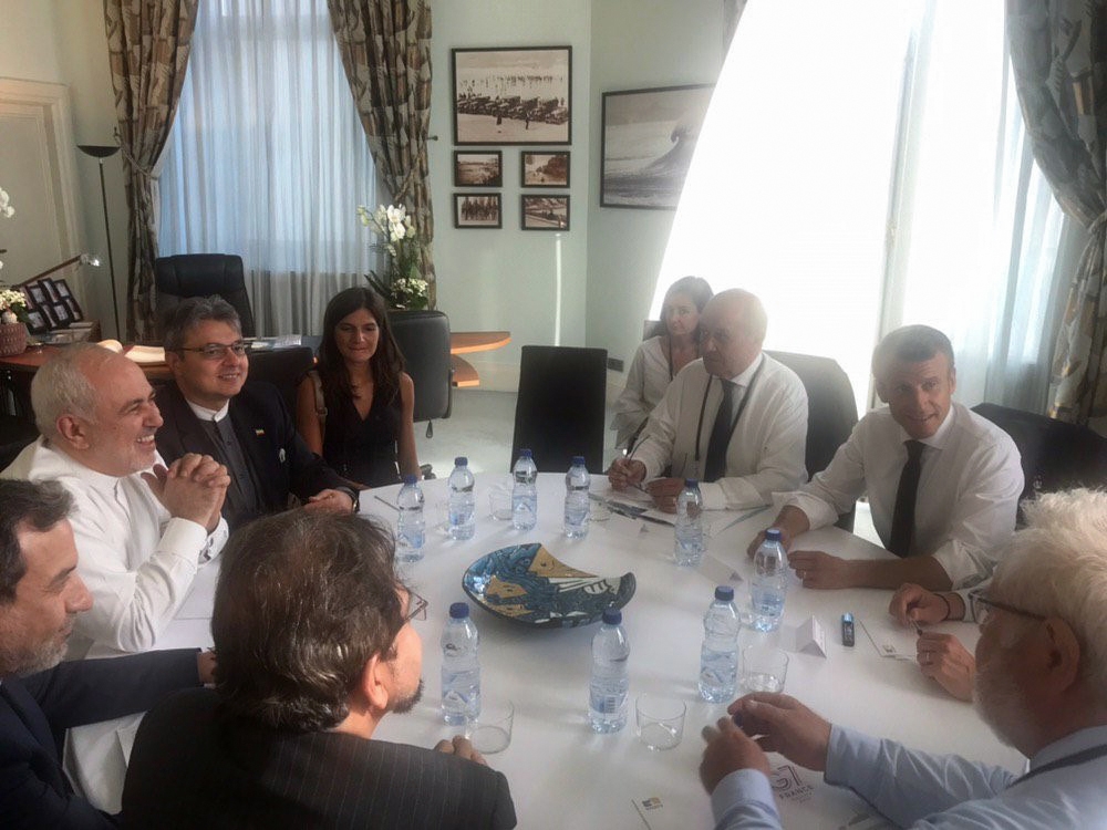 This handout photo obtained from the twitter account of Iranian Foreign Minister Mohammad Javad Zarif, shows French President Emmanuel Macron (2ndR), French Foreign Affairs Minister Jean-Yves Le Drian (3rdR) and French Presidential chief-of-staff Admiral 