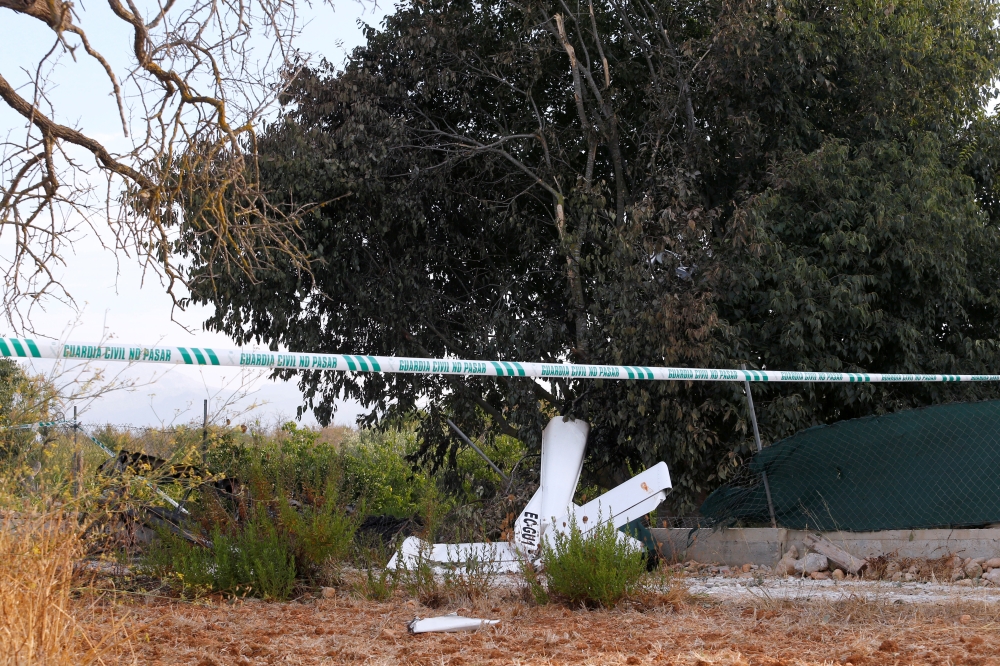 Debris and wreckage parts lay on the ground after a collision between an aircraft and a helicopter near the Village of Inca in the Spanish island of Mallorca, killing 7 passengers on both aircrafts. August 26, 2019. REUTERS/Enrique Calvo