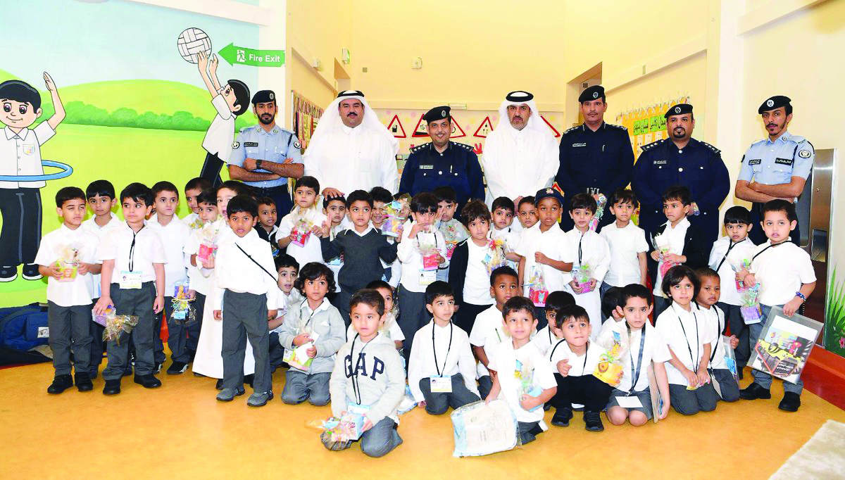 The officials of the General Directorate of Traffic, during a visit to Jawaan Bin Jassim Model Kindergarten for Boys in Al Dafna.