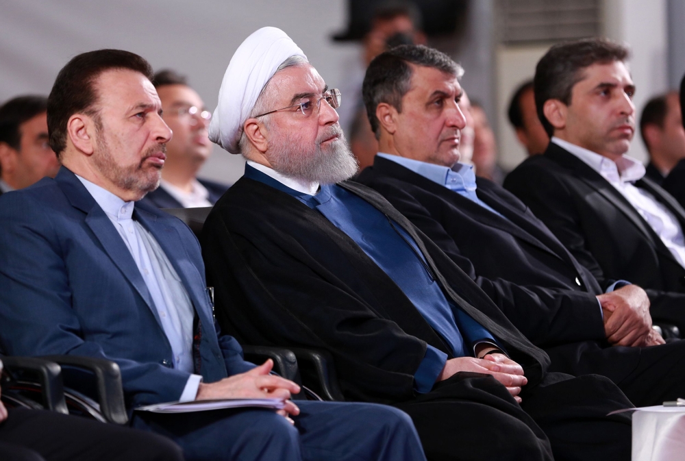 A handout picture provided by the Iranian presidency on August 27, 2019, shows President Hassan Rouhani (2 L) attending a ceremony in the capital Tehran. AFP PHOTO / HO / IRANIAN PRESIDENCY