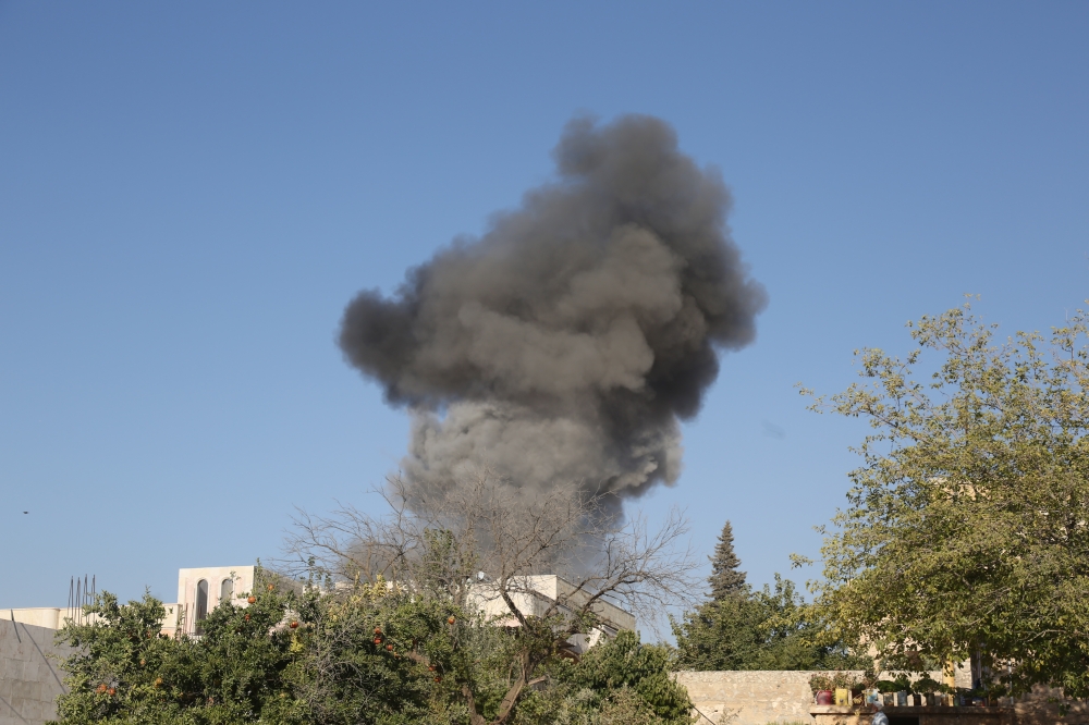 Smoke rises after Assad Regime forces carried out airstrikes over Ma'ar Shoreen village of Idlib, Syria on August 27, 2019. Izeddin Idilbi - Anadolu 