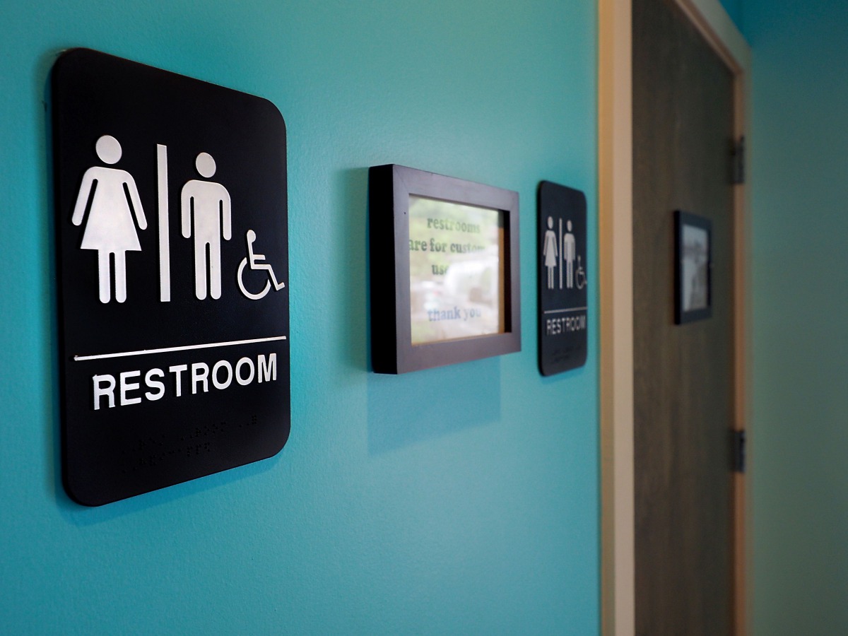 Unisex signs hanging outside bathrooms at Toast Paninoteca in Durham, North Carolina, May 9 2016.  AFP / Getty Images North America / Sara D Davis