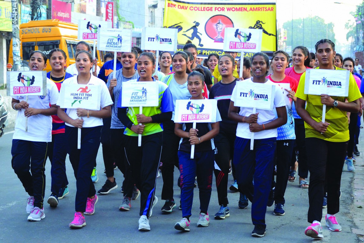 Indian students hold placards as they take part in a walk the first day of the 
