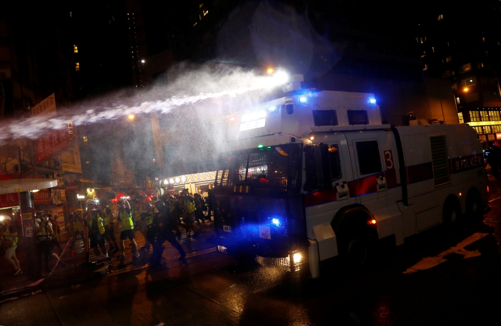 A police water cannon sprays water during a protest in Hong Kong, China August 31, 2019. REUTERS/Kai Pfaffenbach