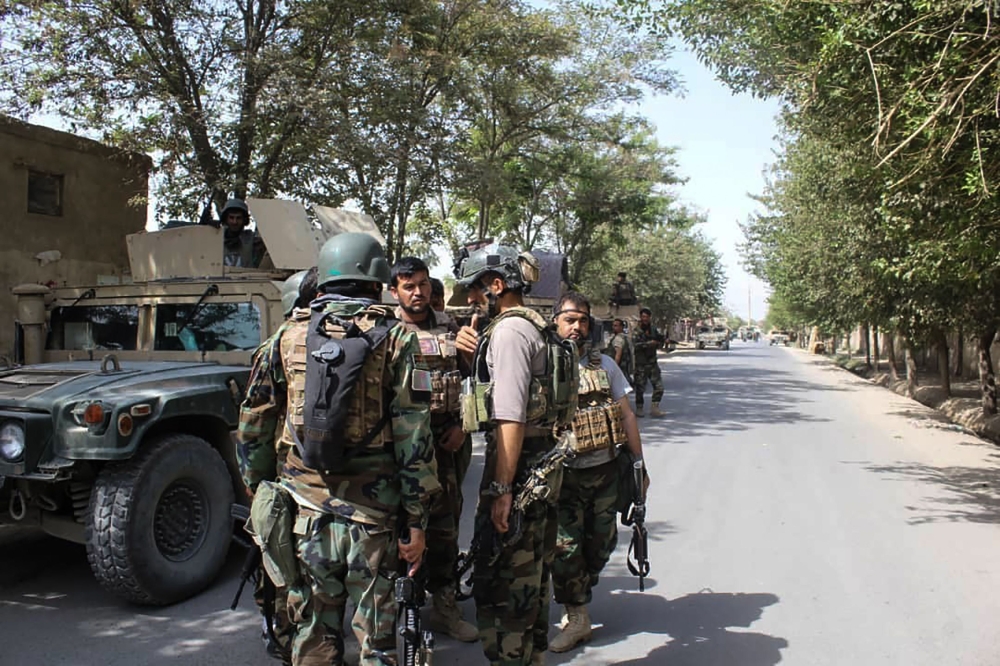 Afghan security forces gather at a street in Kunduz on August 31, 2019. AFP / Bashir KHAN SAFI