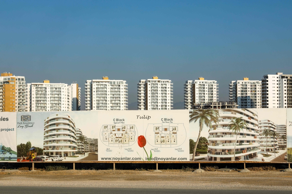 A picture shows a compound under construction along the coast of Trikomo in the self-proclaimed Turkish Republic of Northern Cyprus (TRNC) on July 25, 2019. AFP / Emily IRVING-SWIFT