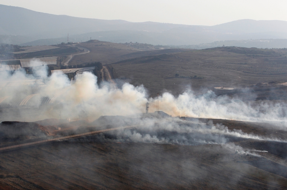 Smoke rises from shells fired from Israel in Maroun Al-Ras village, near the border with Israel, in southern Lebanon, September 1, 2019. REUTERS/Aziz Taher	
