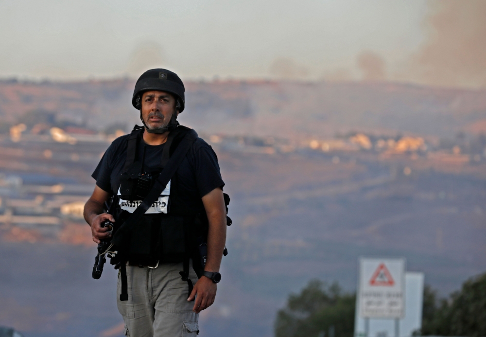A member of the Israeli security forces stands at a security checkpoint near the northern Israeli town of Avivim, close to the border with Lebanon, on September 1, 2019. AFP /Jalaa Marey 