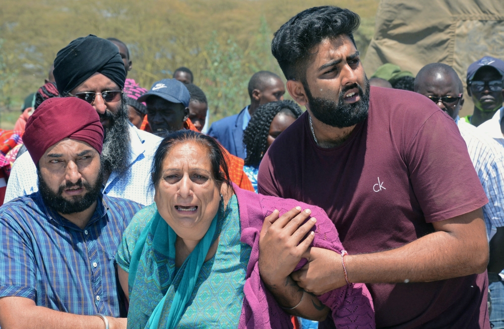 People mourn as Kenya Red Cross workers and volunteers retrieve the bodies of their relatives who died in flash floods while on an excursion at the Hell's Gate National Park in Naivasha, Kenya September 2, 2019. REUTERS/Stringer