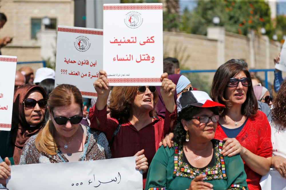 Palestinian women protest in support of women’s rights outside the prime minister’s office in the West Bank city of Ramallah on September 2, 2019, after a young Palestinian died in a case that has raised emotions. AFP / ABBAS MOMANI