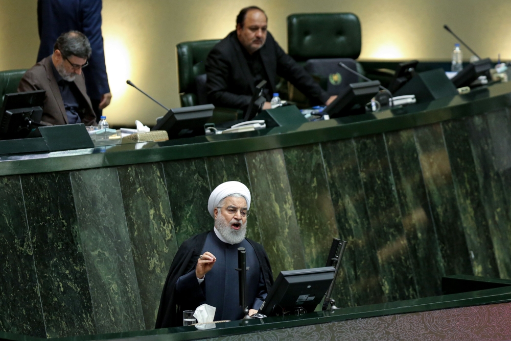Iran's President Hassan Rouhani (bottom) speaks at parliament in the capital Tehran on September 3, 2019. AFP / ATTA KENARE