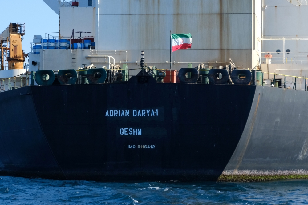 (FILES) In this file photo taken on August 18, 2019, an Iranian flag flutters on board the Adrian Darya oil tanker, formerly known as Grace 1, off the coast of Gibraltar. AFP / Johnny Bugeja 