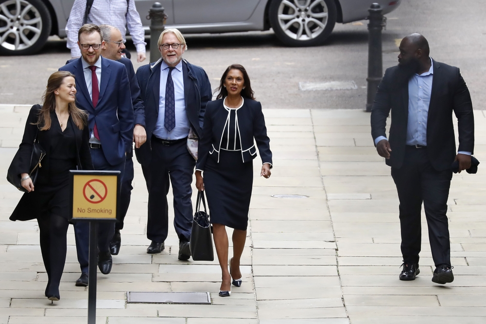 Business owner and anti-Brexit activist Gina Miller (C) arrives at the High Court, London on September 6, 2019, to receive the verdict of an urgent judicial review brought by herself and former prime minister John Major, challenging the suspension of the 