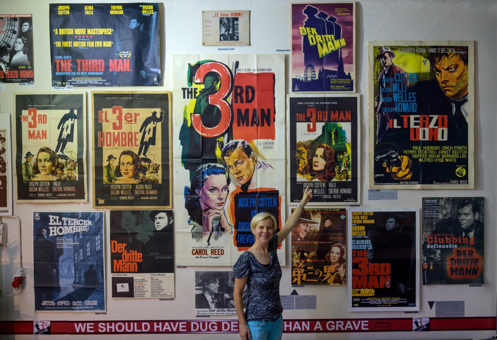 Karin Hoefler, co-founder of the Third Man museum, points at the original poster promoting the movie, in Vienna, Austria on September 4, 2019.  AFP / Joe Klamar
