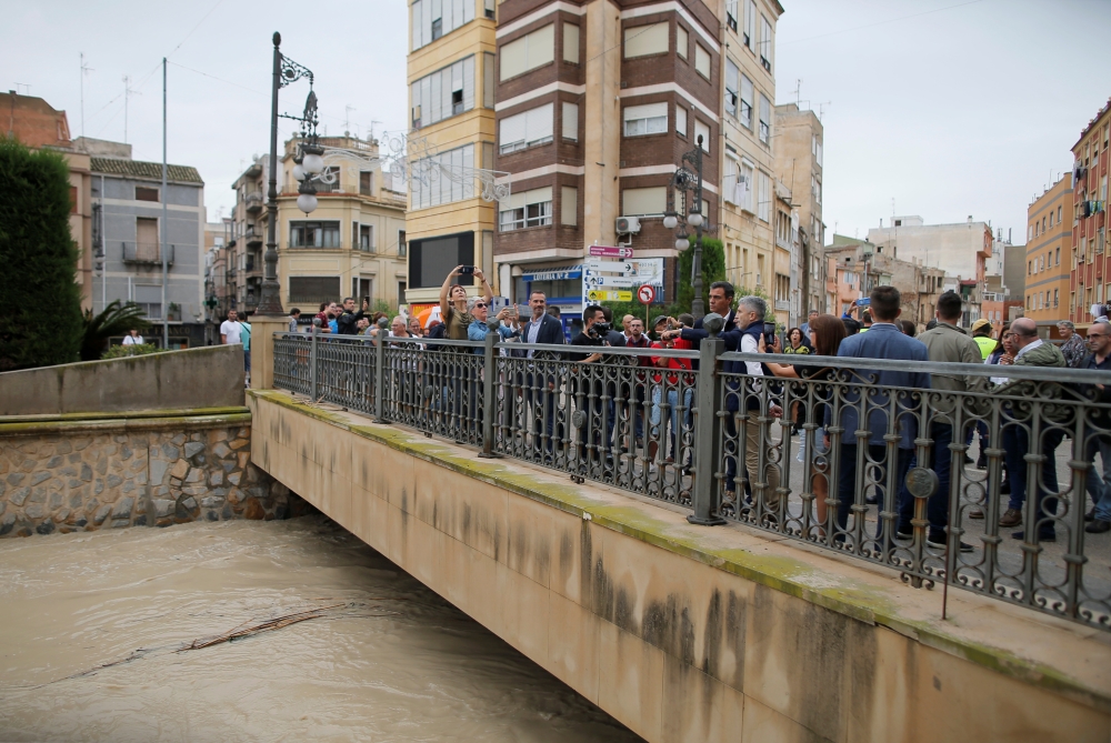 Spain's acting Prime Minister Pedro Sanchez and and Interior Minister Fernando Grande-Marlaska visit the bridge over Segura river in a flooded town of Orihuela, Spain, September 14, 2019. REUTERS/Jon Nazca