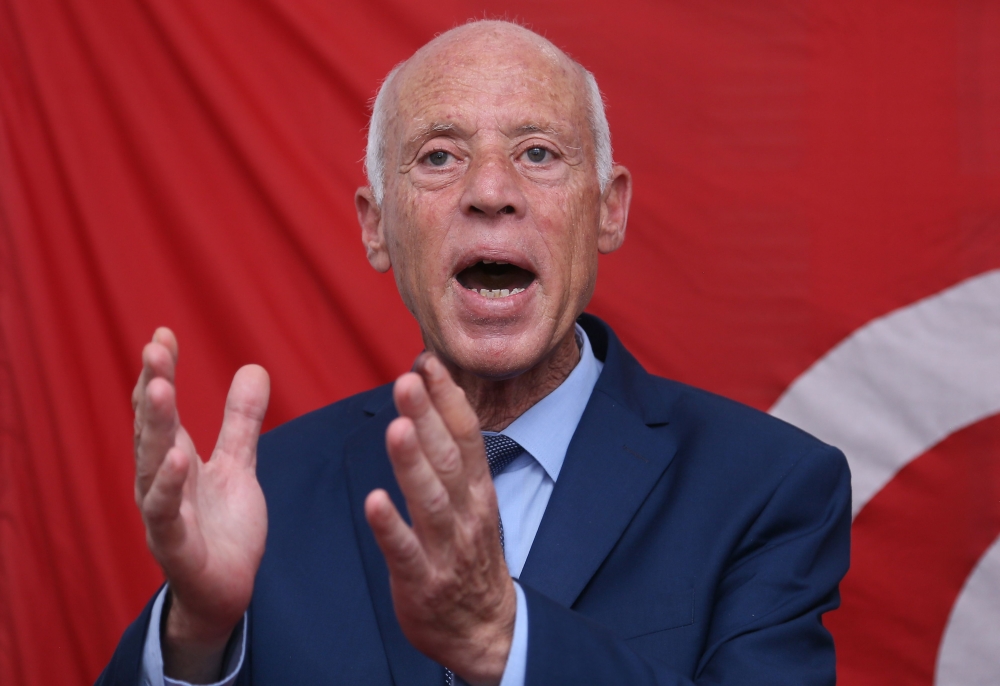 Kais Saied gestures as he speaks during a press conference in Tunis on September 17, 2019, following the announcement of official results in the first round of Tunisia's presidential election. AFP / Anis Mili 