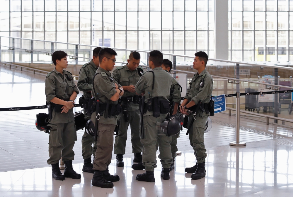 Riot police stand inside Hong Kong International Airport in Hong Kong, China September 22, 2019. REUTERS/Jorge Silva