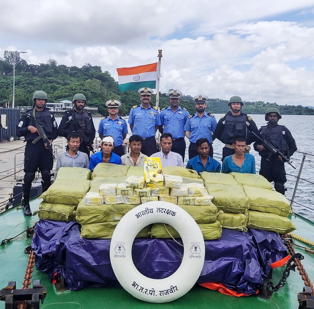 Indian Coast Guard with Myanmarese ship's crew after seizing 1160 kg of Ketamine drug from their boat near Car Nicobar islands on September 19, 2019. AFP / Indian Ministry of Defence handout