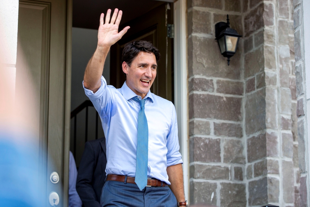 Canada's Prime Minister Justin Trudeau waves to supporters after speaking at an election campaign stop in Brampton, Ontario, Canada September 22, 2019. REUTERS/Carlos Osori/File Photo