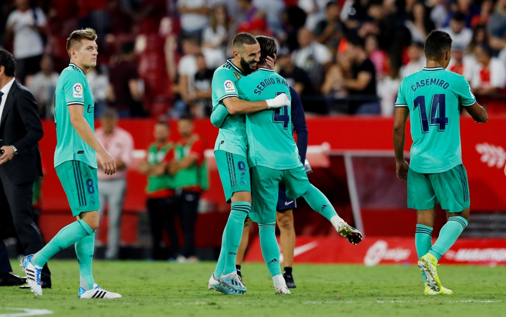 Real Madrid's Sergio Ramos and Karim Benzema celebrate at the end of the match REUTERS/Marcelo Del Pozo